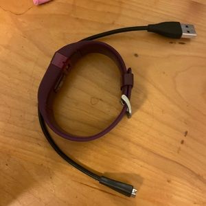 Purple Fit Bit with charger